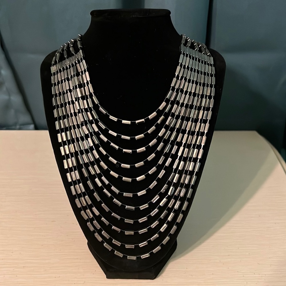 Necklace is 21” full length - adjustable. No wear.A very pretty piece of jewelry